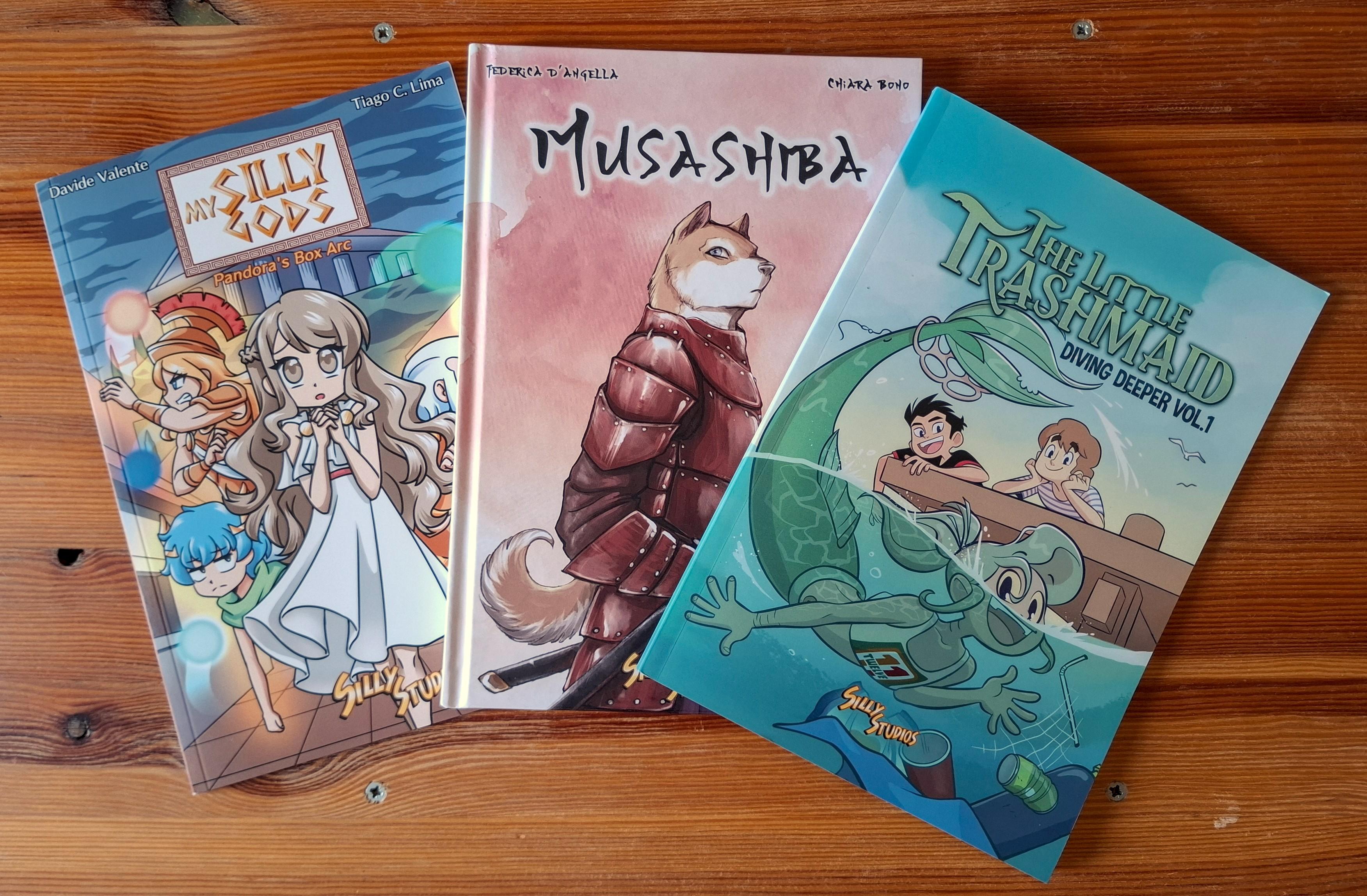 A sample of three books already published by Silly Studios: My Silly Gods, Musashiba, The Little TrashMaid.